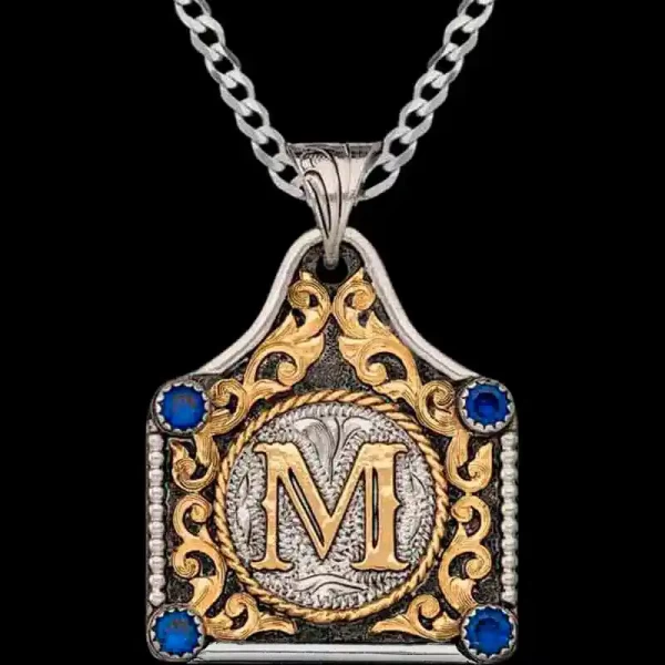 The Bessie Custom Cow Tag Necklace features German Silver, antique finish, bead and line edge, CZ stones and custom scrolls. Add initials or your ranch brand.